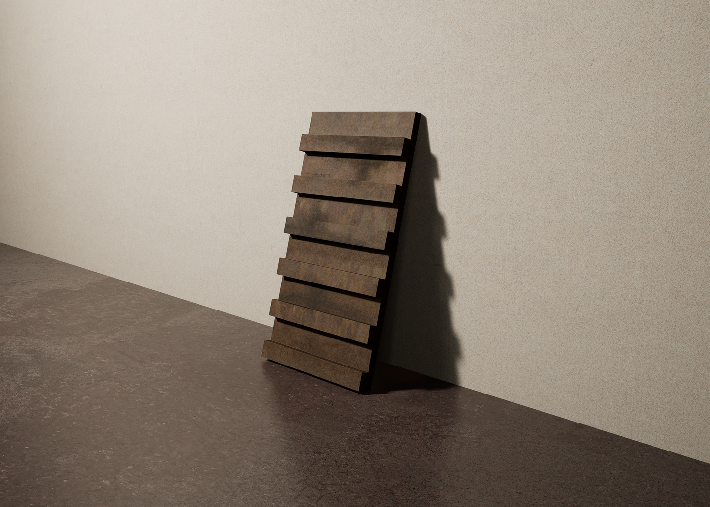 a 15"x8" bespoke dimensional concrete tile with six evenly spaced tiers leans against a textured, plaster wall on an unfinished concrete floor