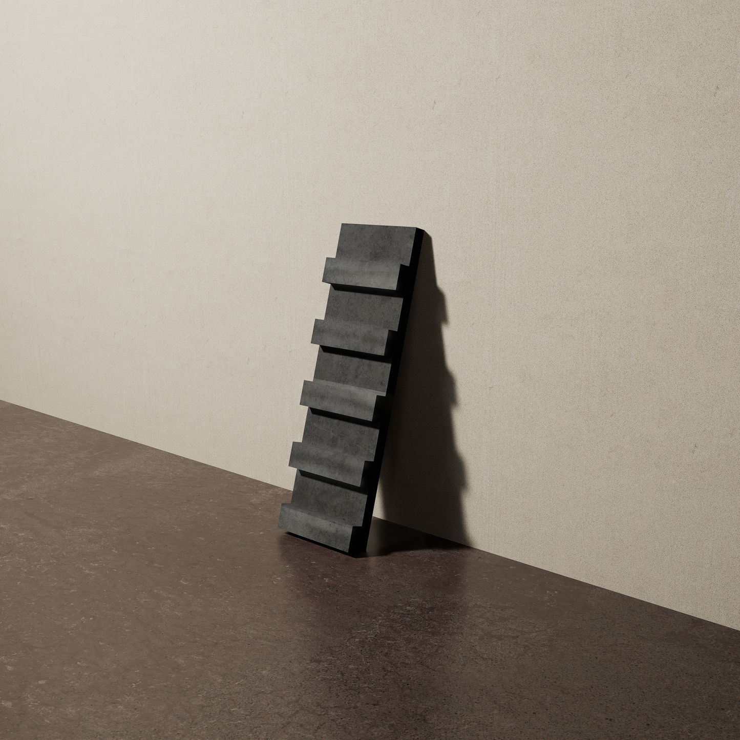 a 4"x12.5" bespoke dimensional concrete tile with five evenly spaced tiers leans against a textured, plaster wall on an unfinished concrete floor