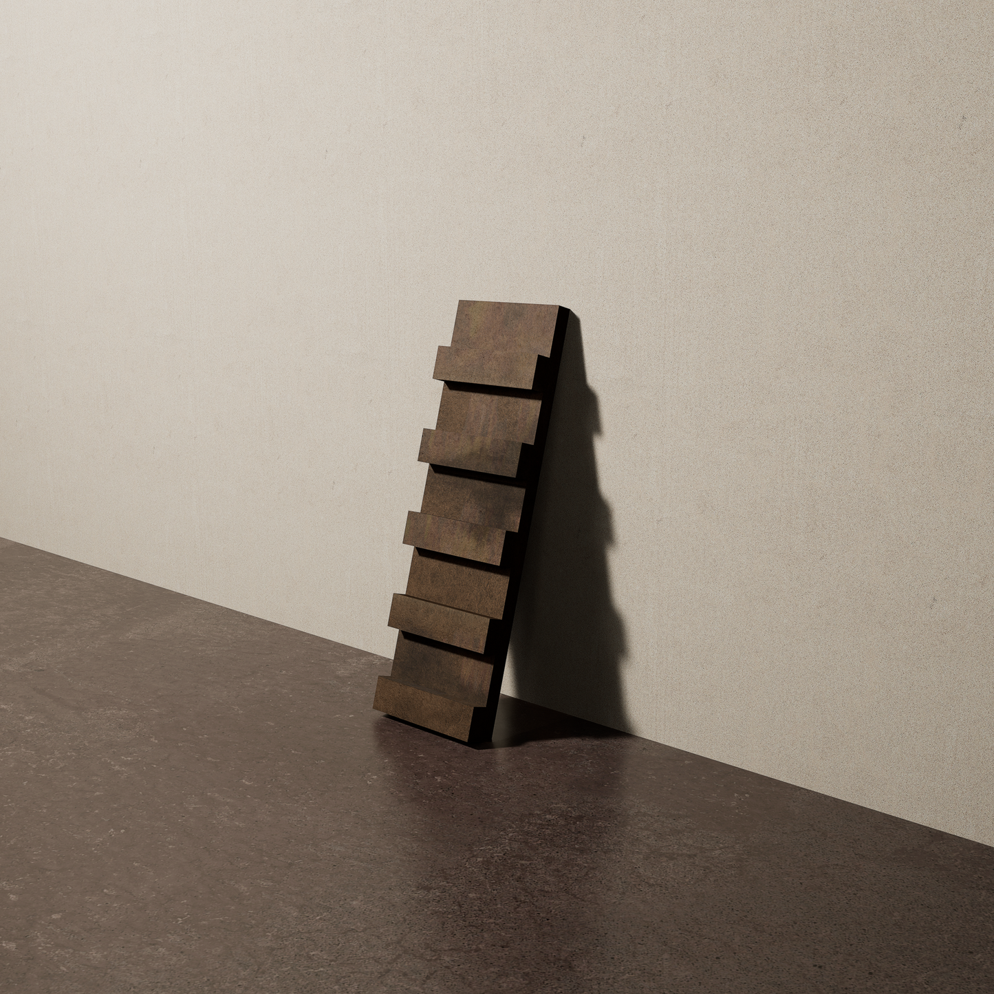 a 4"x12.5" bespoke dimensional concrete tile with five evenly spaced tiers leans against a textured, plaster wall on an unfinished concrete floor