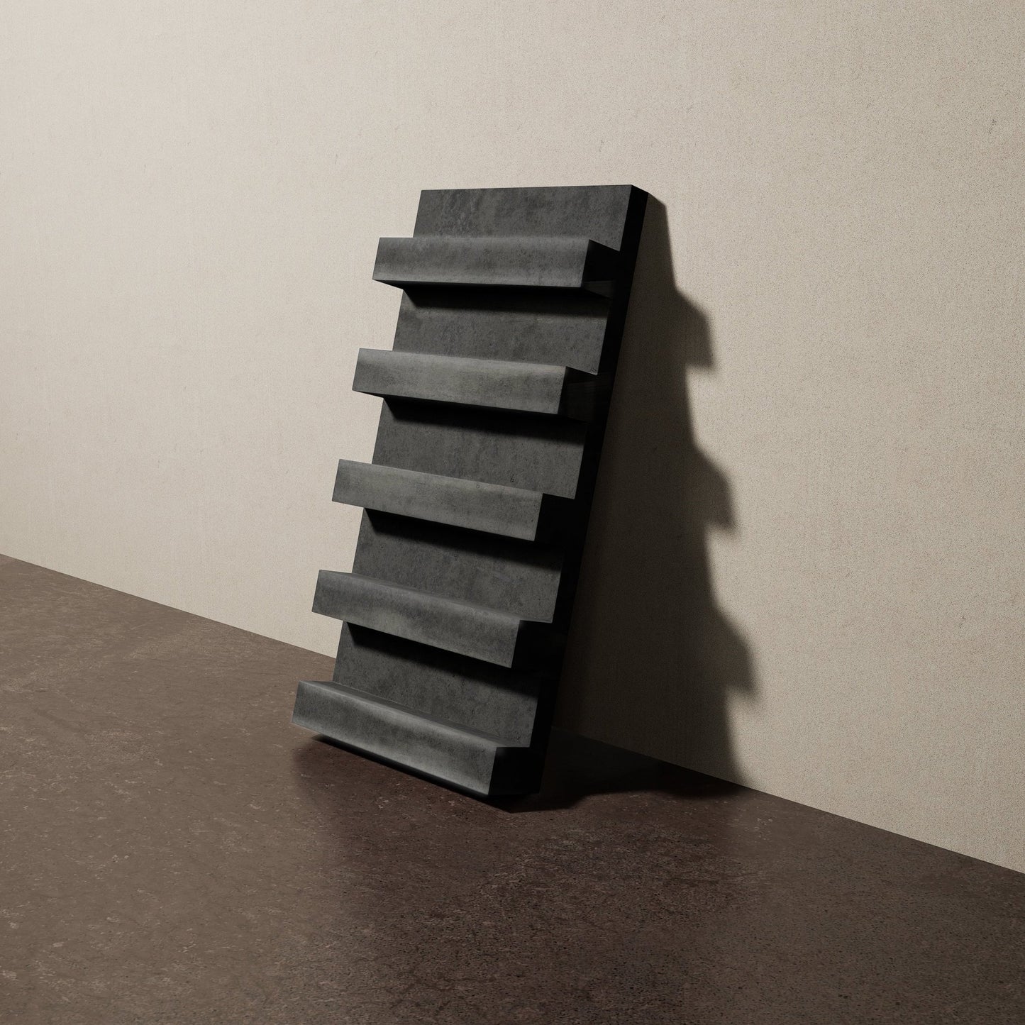 a 16"x8" bespoke heavy concrete tile with five evenly spaced ribs leans against a textured, plaster wall on an unfinished concrete floor