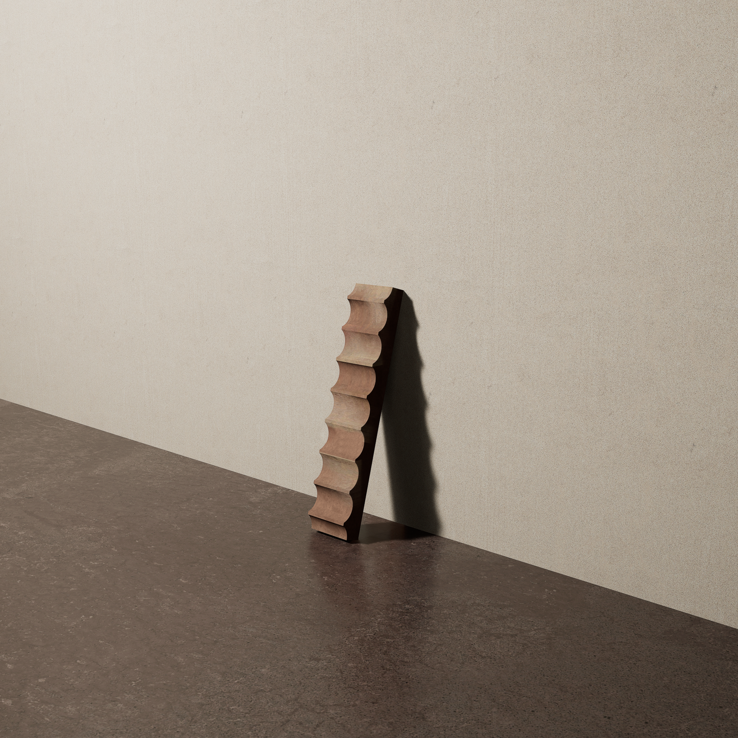 a 2"x10" bespoke fluted concrete tile with eight peaks leans against a textured, plaster wall on an unfinished concrete floor