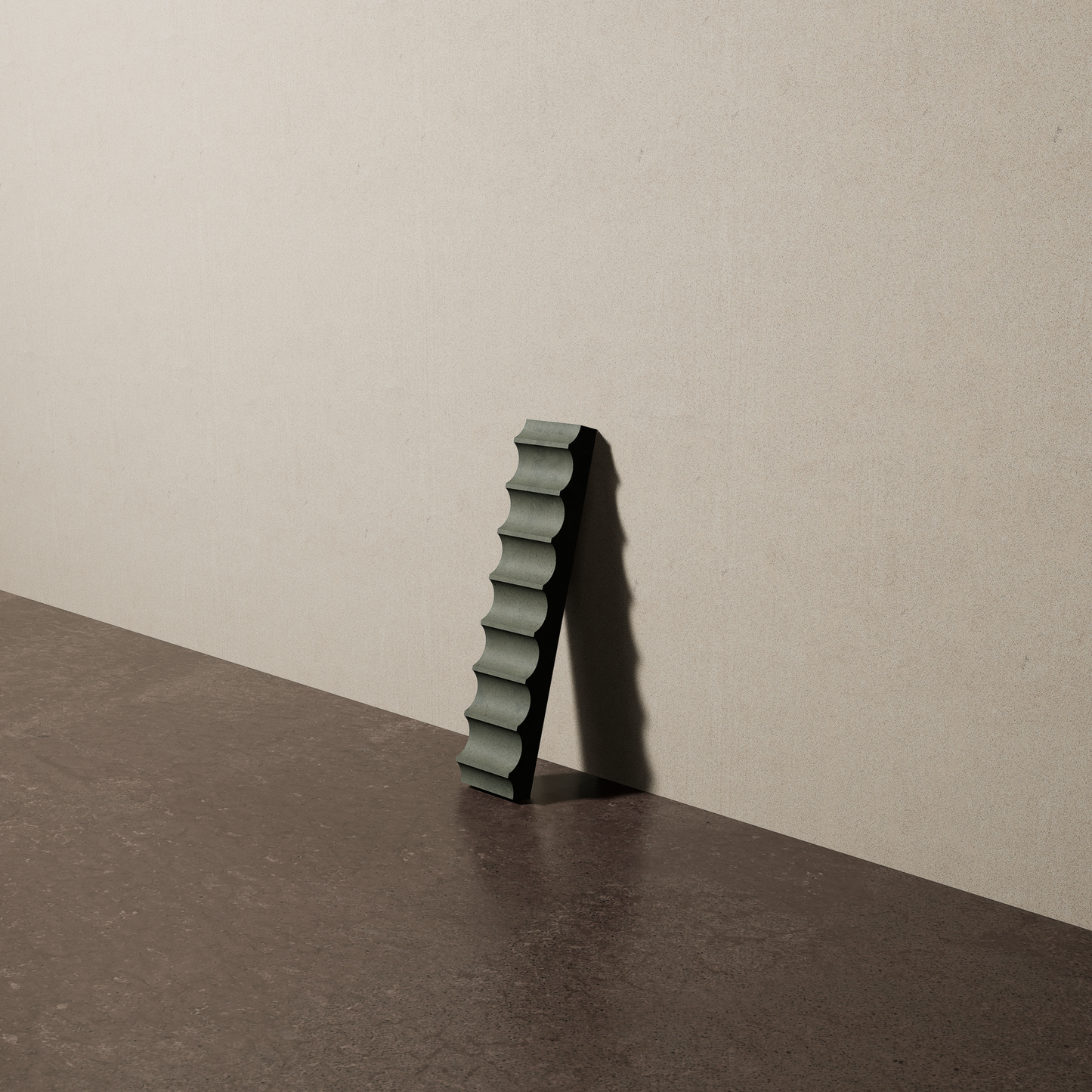 a 2"x10" bespoke fluted concrete tile with eight peaks leans against a textured, plaster wall on an unfinished concrete floor