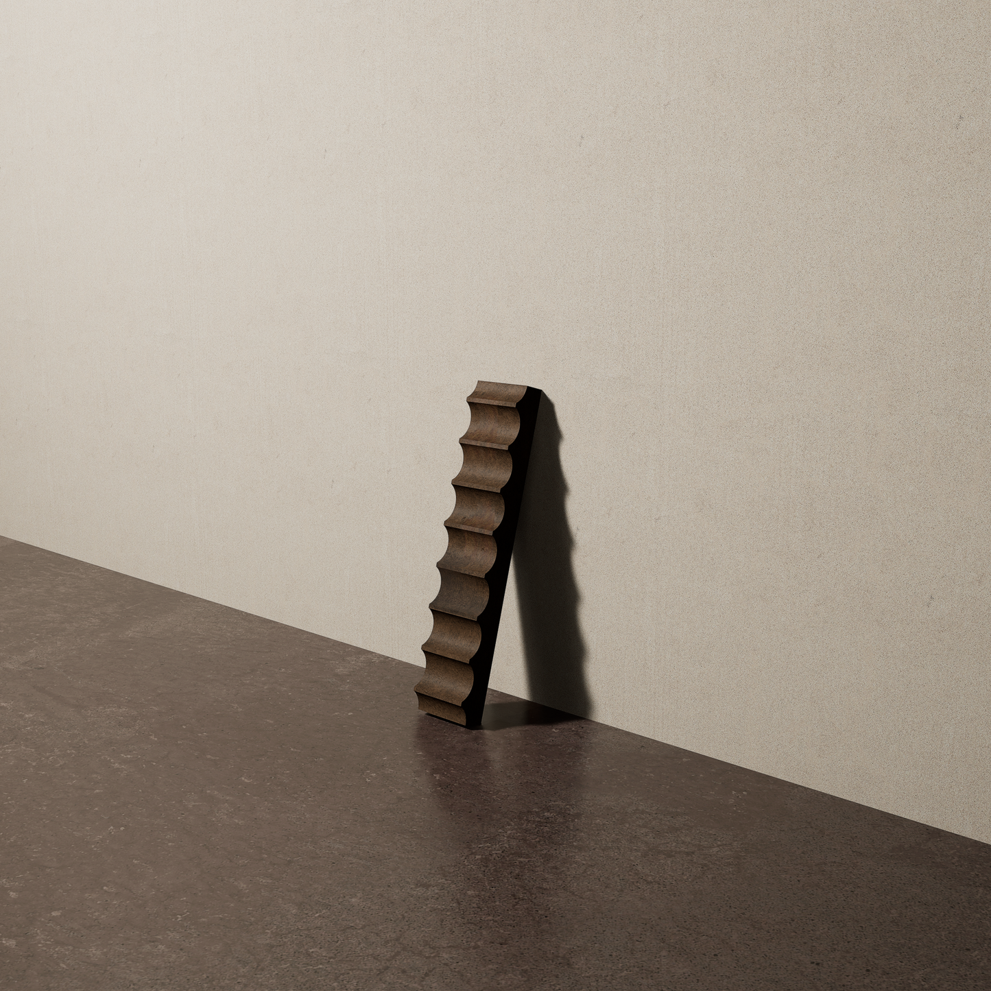 a 2"x10" bespoke fluted concrete tile with eight peaks leans against a textured, plaster wall on an unfinished concrete floor