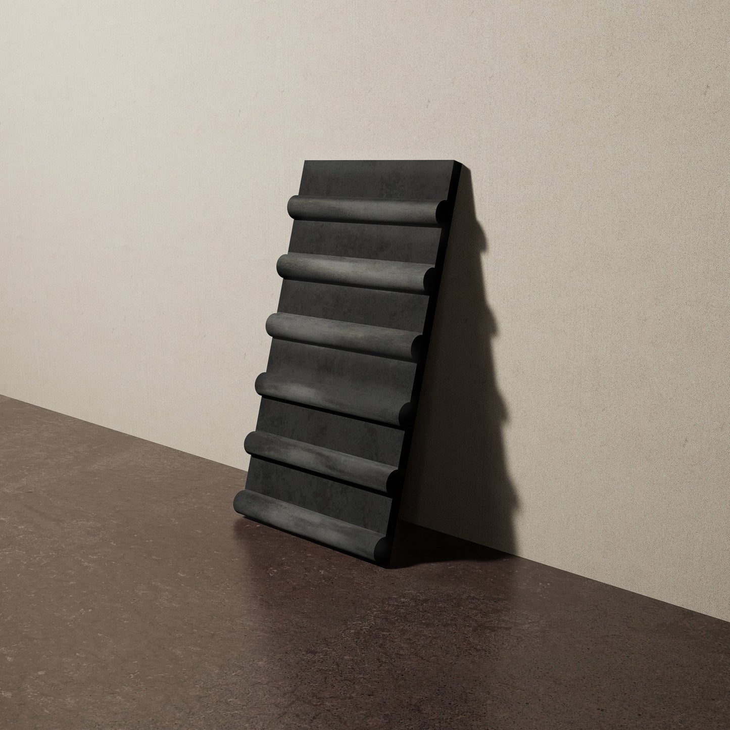 a 8"x15" bespoke concrete tile with six rounded ribs leans against a textured, plaster wall on an unfinished concrete floor
