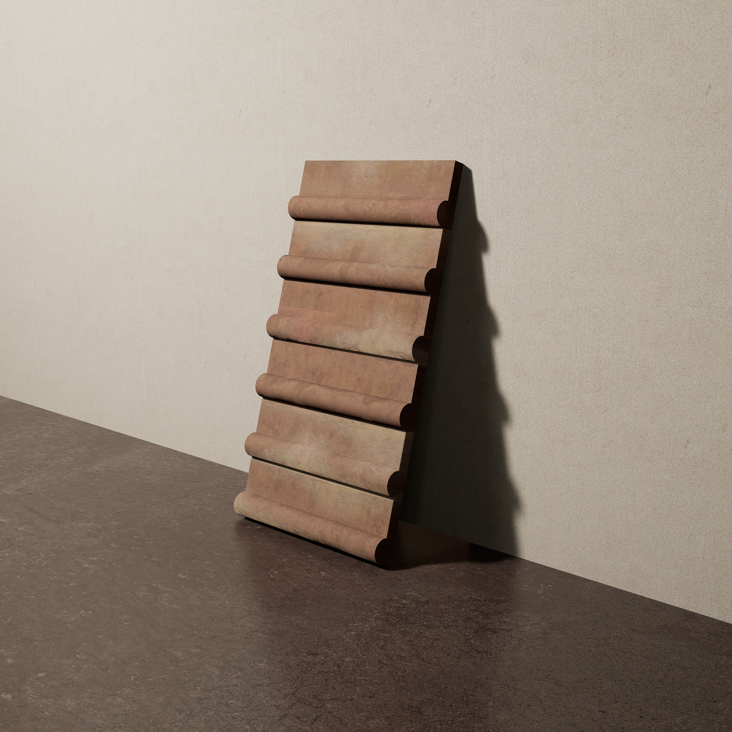 a 8"x15" bespoke concrete tile with six rounded ribs leans against a textured, plaster wall on an unfinished concrete floor