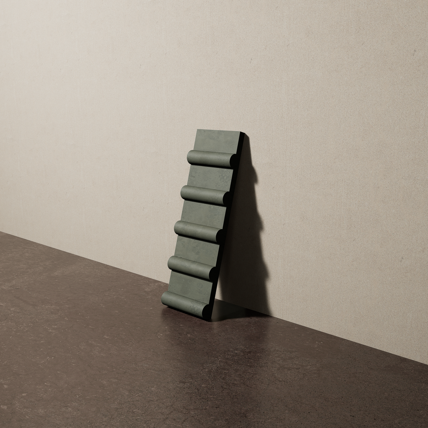a 4"x12.5" bespoke concrete tile with five rounded ribs leans against a textured, plaster wall on an unfinished concrete floor