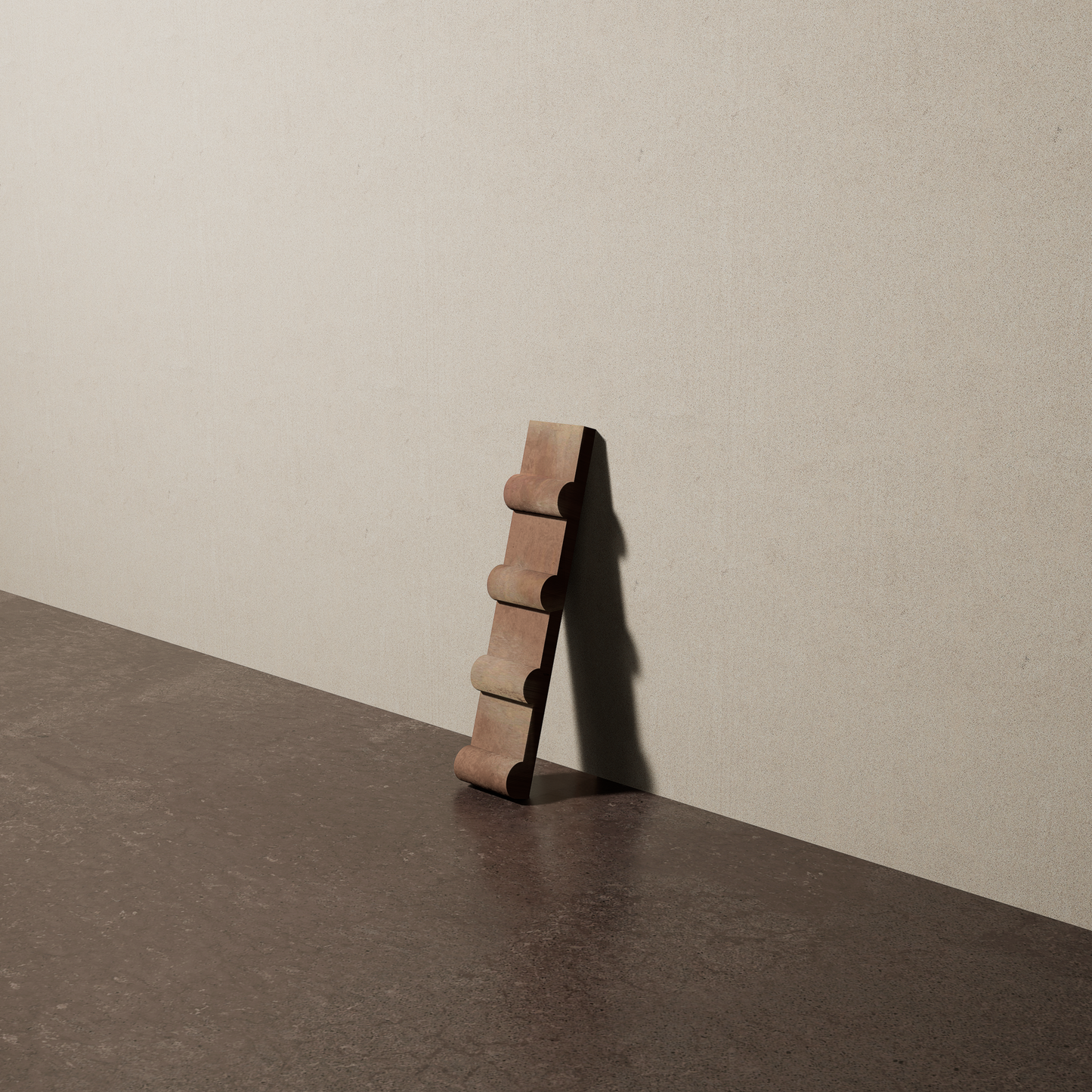 a 2"x10" bespoke concrete tile with four rounded ribs leans against a textured, plaster wall on an unfinished concrete floor