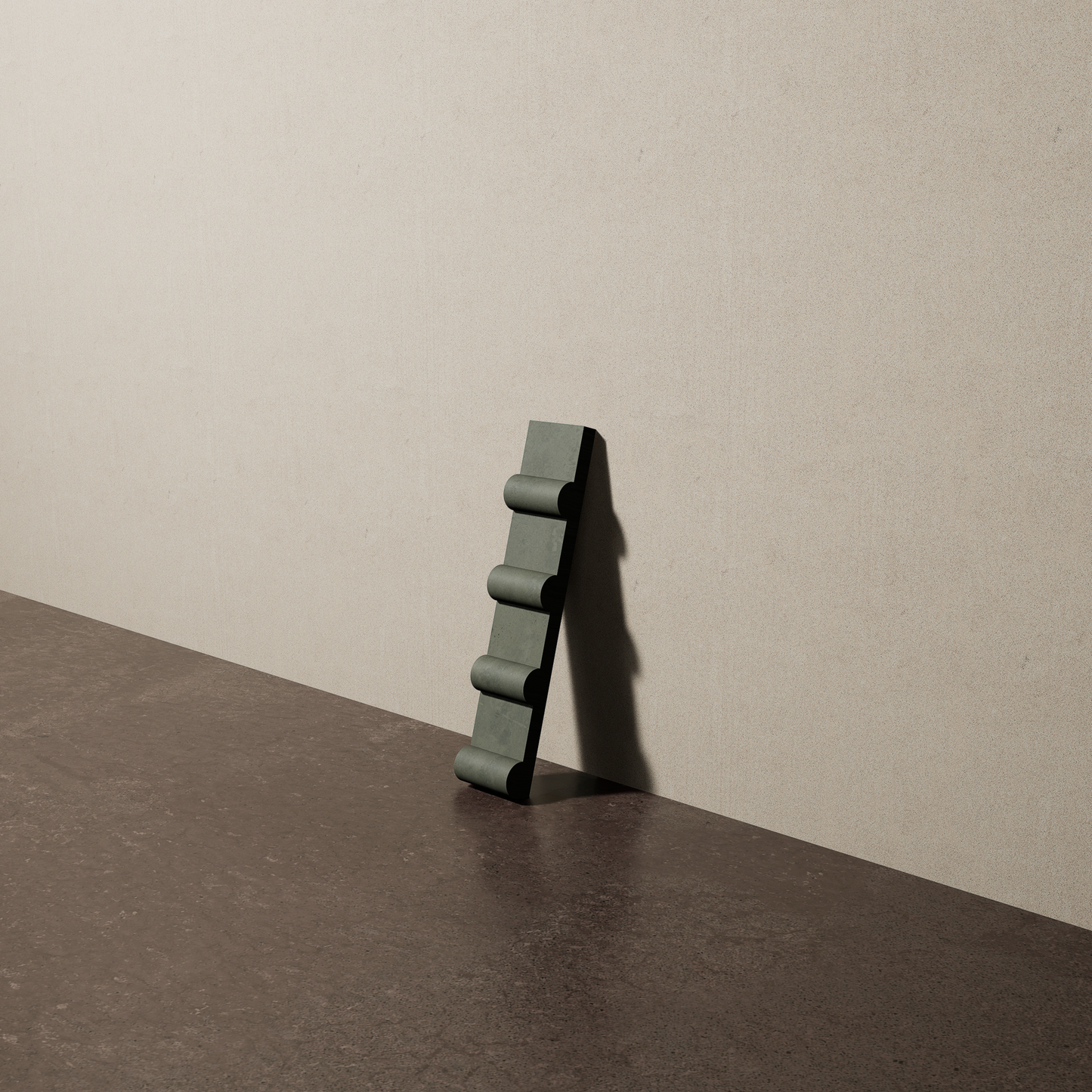 a 2"x10" bespoke concrete tile with four rounded ribs leans against a textured, plaster wall on an unfinished concrete floor