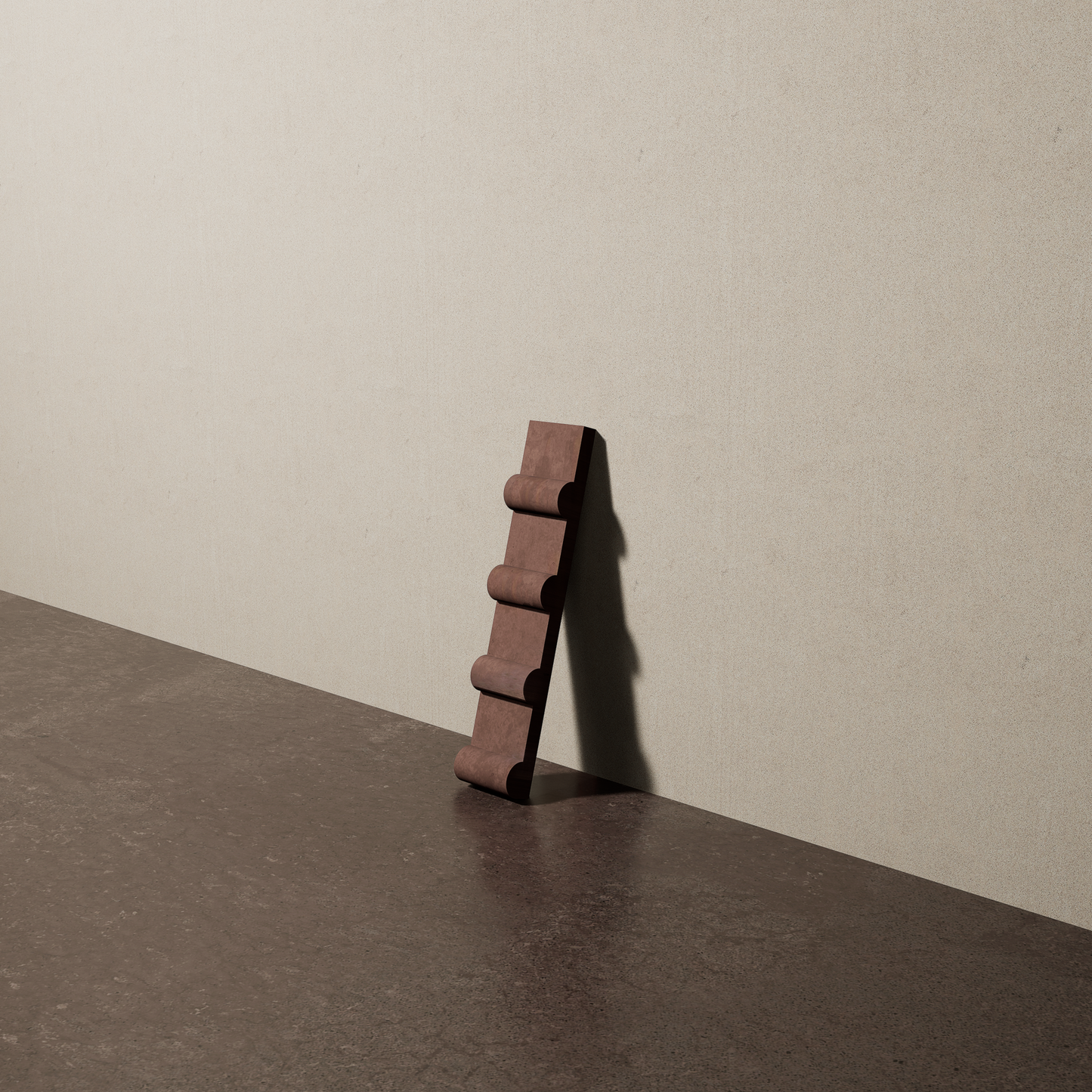 a 2"x10" bespoke concrete tile with four rounded ribs leans against a textured, plaster wall on an unfinished concrete floor