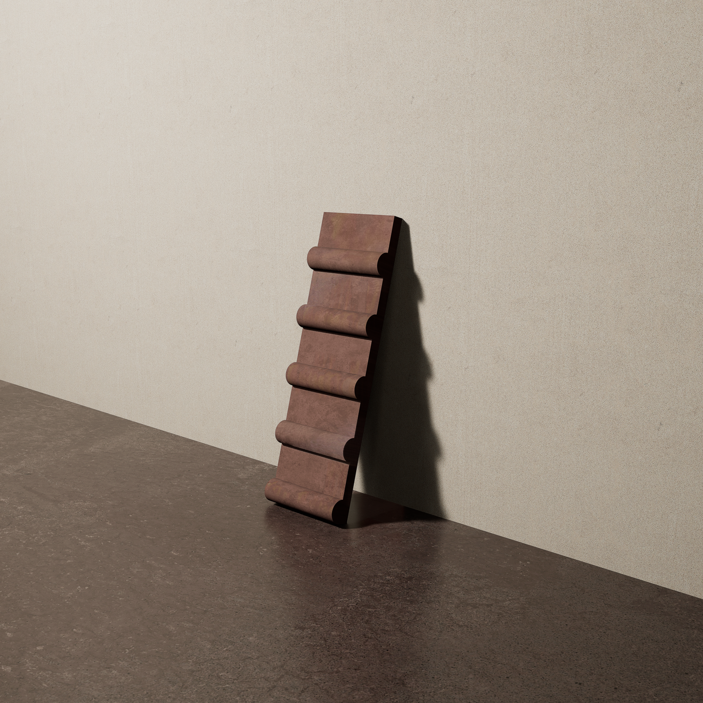 a 4"x12.5" bespoke concrete tile with five rounded ribs leans against a textured, plaster wall on an unfinished concrete floor