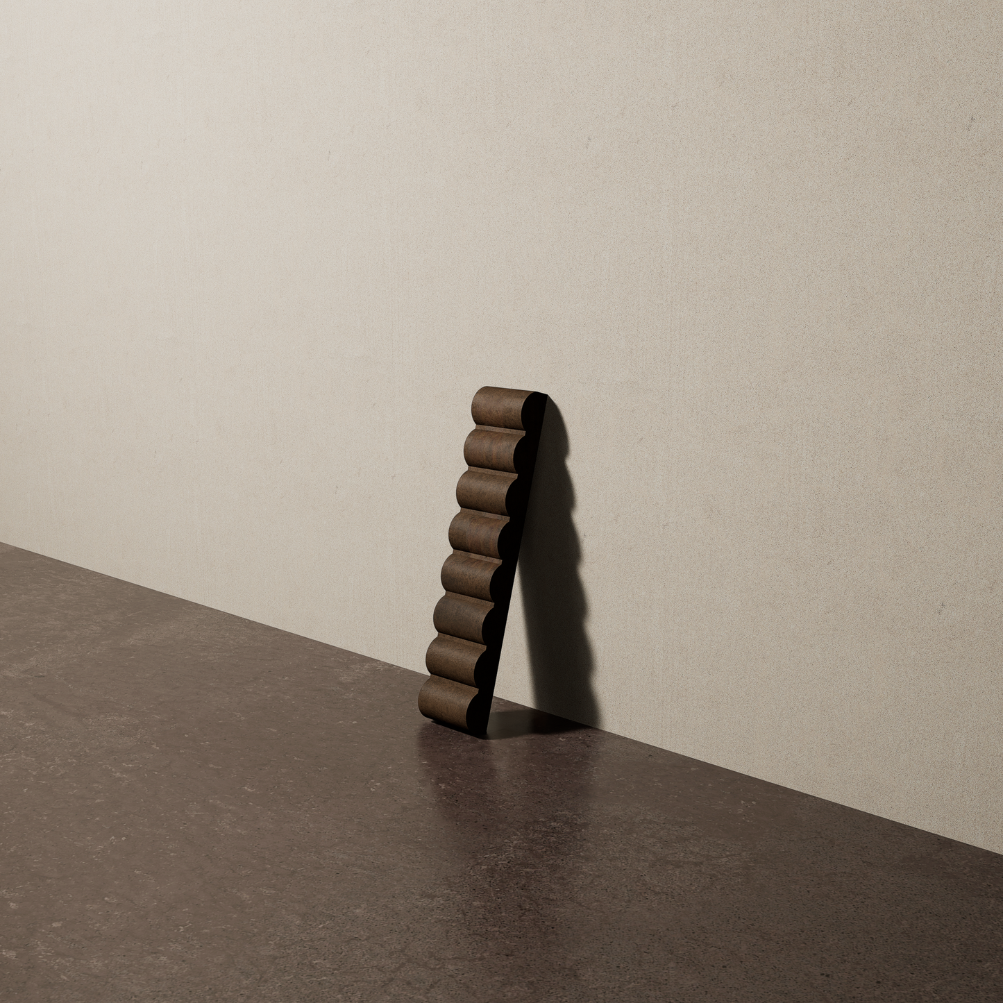 a 2"x10" bespoke reeded concrete tile with eight ribs leans against a textured, plaster wall on an unfinished concrete floor